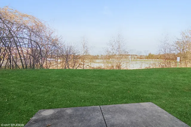 a view of green field with lake view