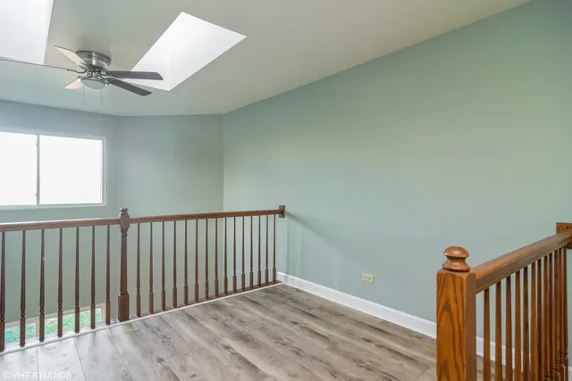 a view of hallway with wooden floor