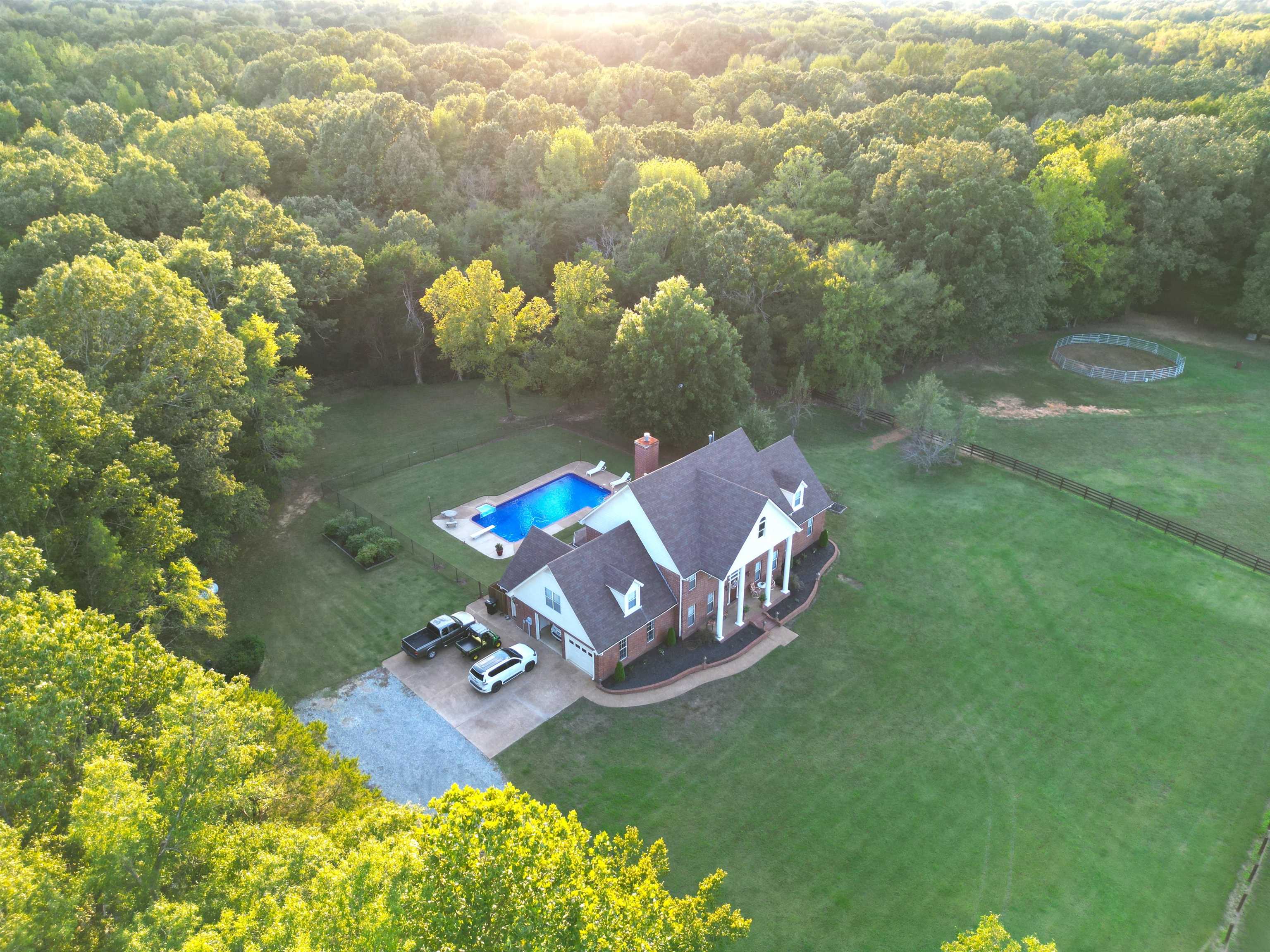 705 Old Solomon Mill Road Somerville, TN 38068 - Photo 1 of 40 an aerial view of a house with a yard