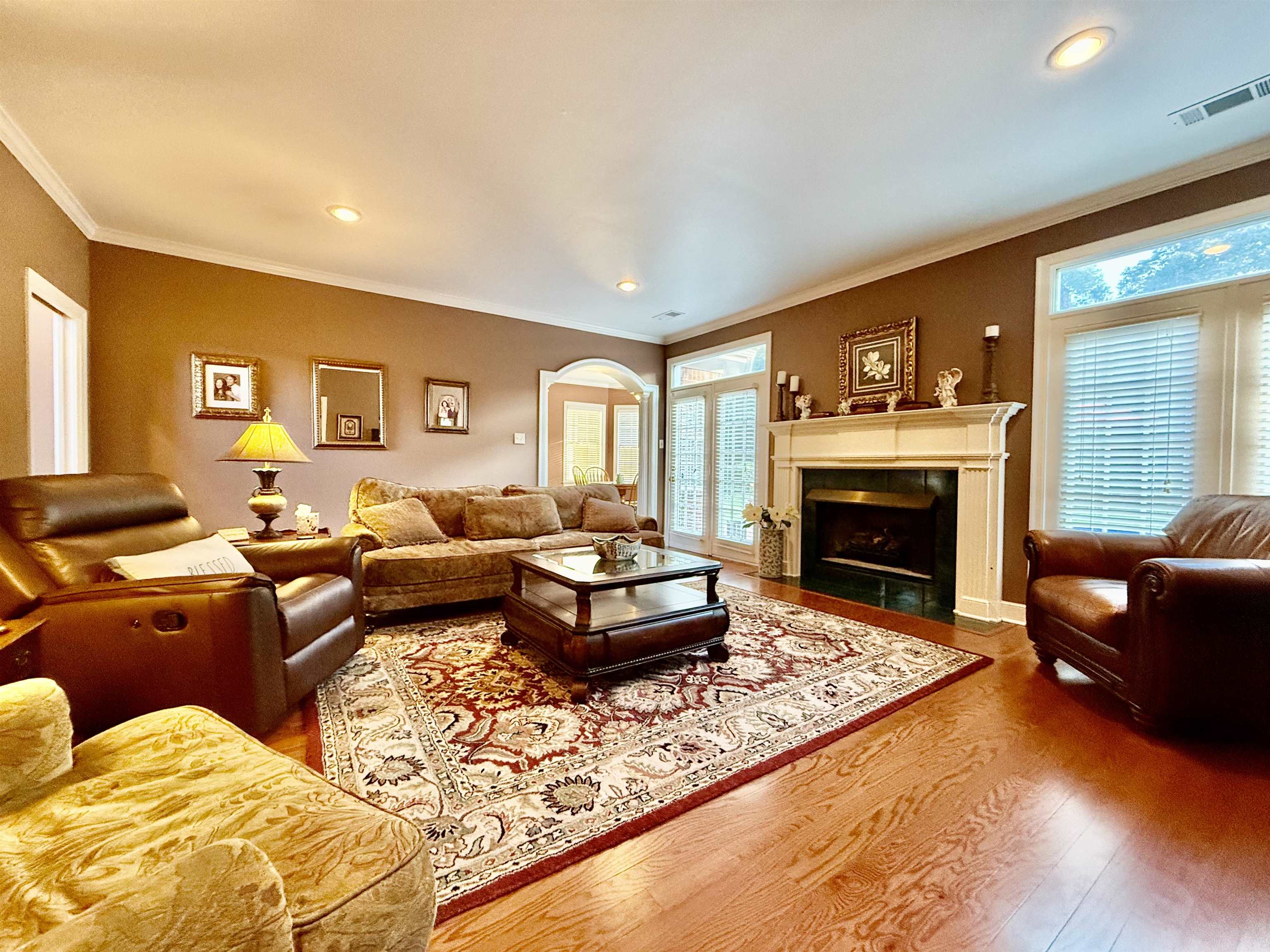 705 Old Solomon Mill Road Somerville, TN 38068 - Photo 12 of 40 a living room with furniture large window and a fireplace