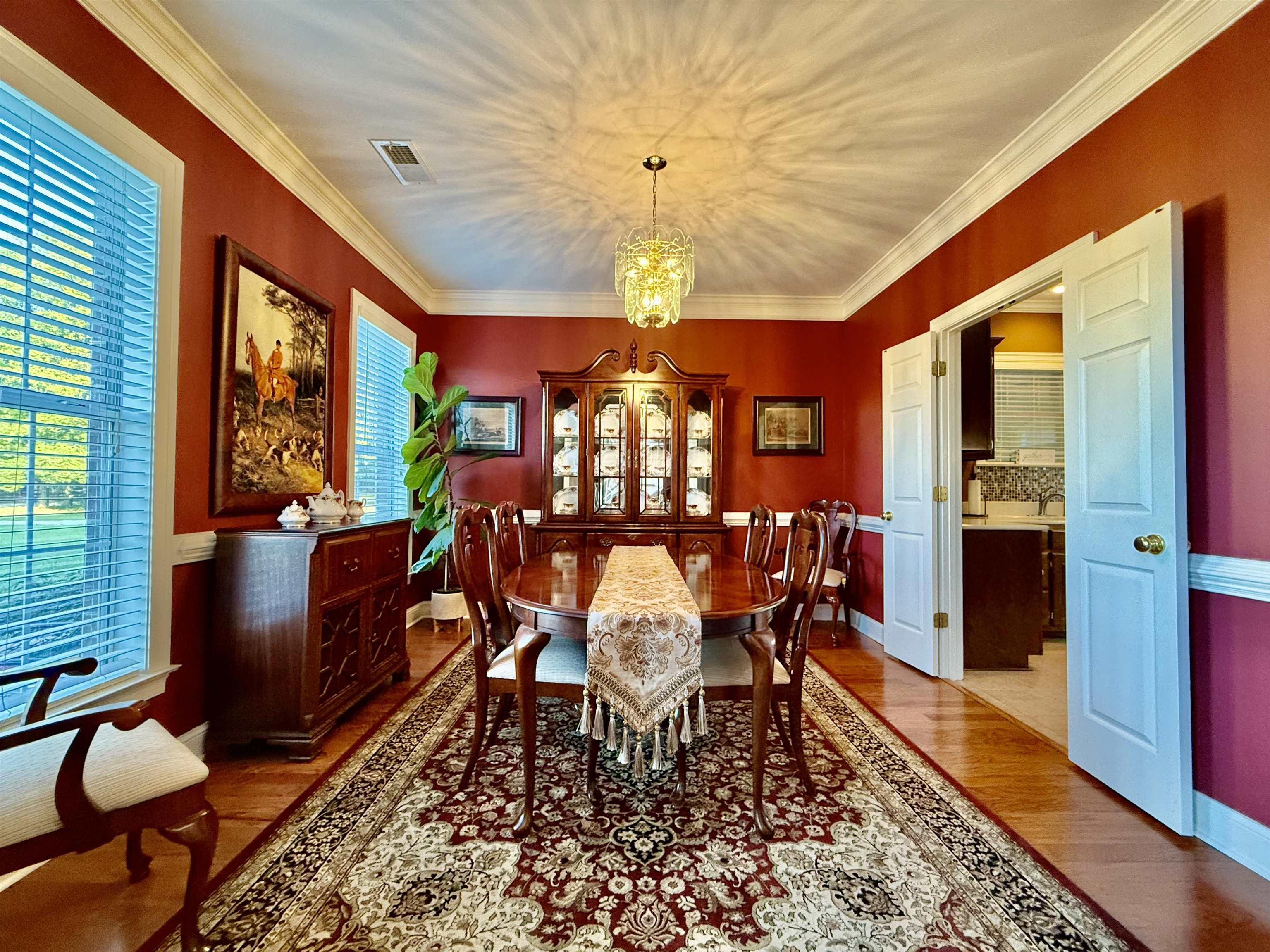 705 Old Solomon Mill Road Somerville, TN 38068 - Photo 9 of 40 a dining room with furniture a chandelier and a rug