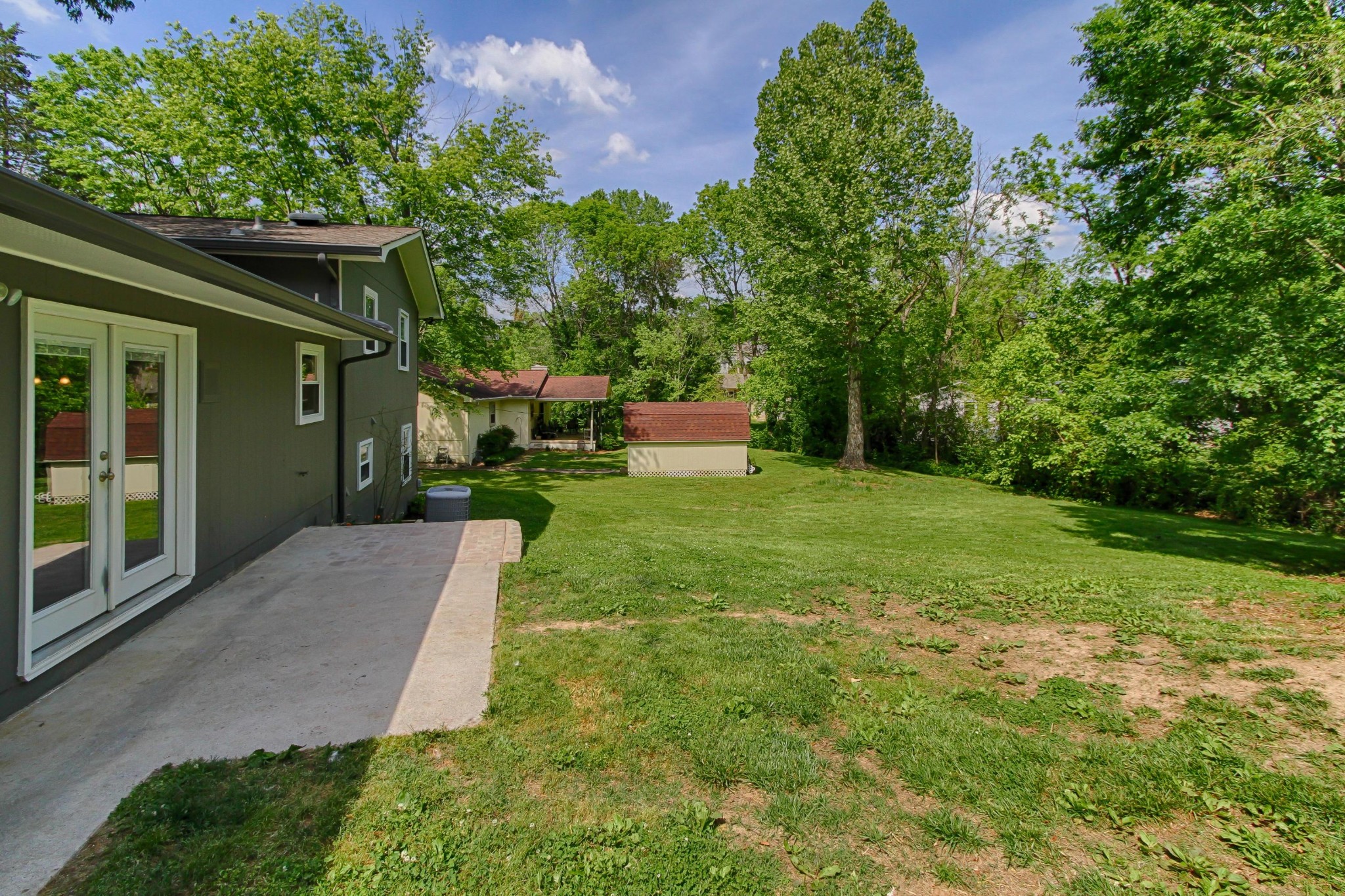 128 Culver Road Oak Ridge, TN 37830 - Photo 14 of 14 a view of a backyard with plants and large trees