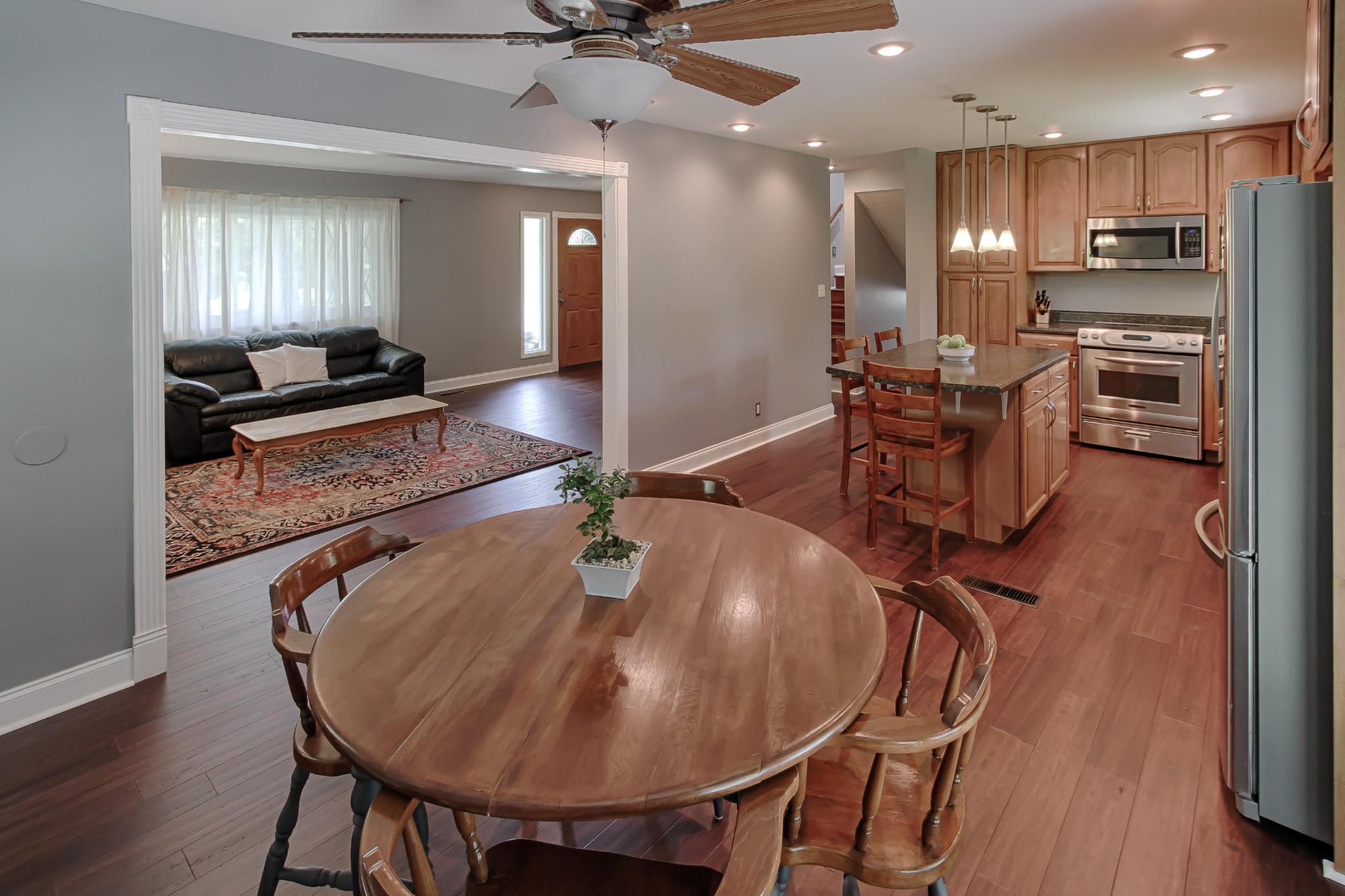 128 Culver Road Oak Ridge, TN 37830 - Photo 5 of 14 a very nice looking dining room with kitchen island a stove a table and chairs