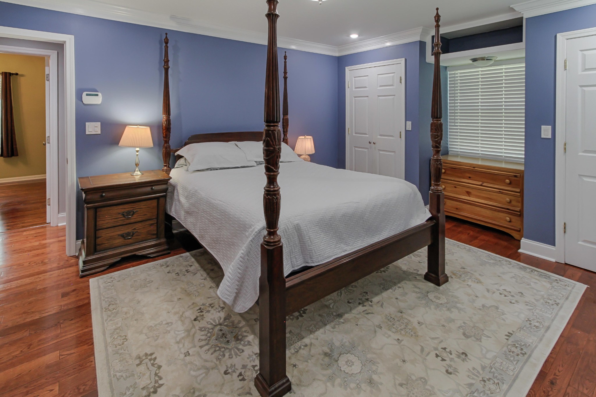 128 Culver Road Oak Ridge, TN 37830 - Photo 7 of 14 a bedroom with a bed and a dresser with mirror