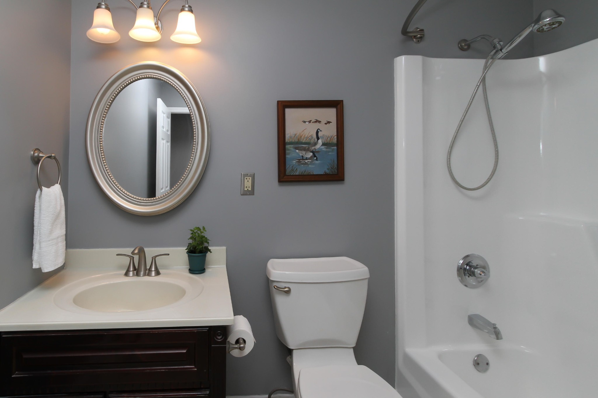 128 Culver Road Oak Ridge, TN 37830 - Photo 10 of 14 a bathroom with a sink a toilet and a mirror