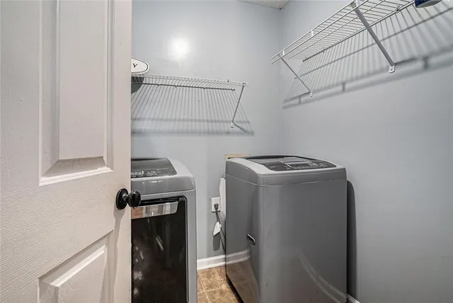 a utility room with dryer and washer