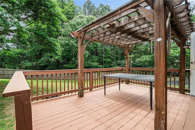 a view of a deck with wooden floor and outdoor space