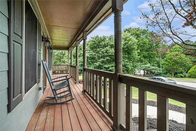 a view of balcony with wooden floor