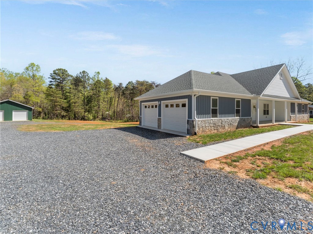 143 High School Road Buckingham, VA 23921 - Photo 3 of 50 a front view of a house with a yard and garage