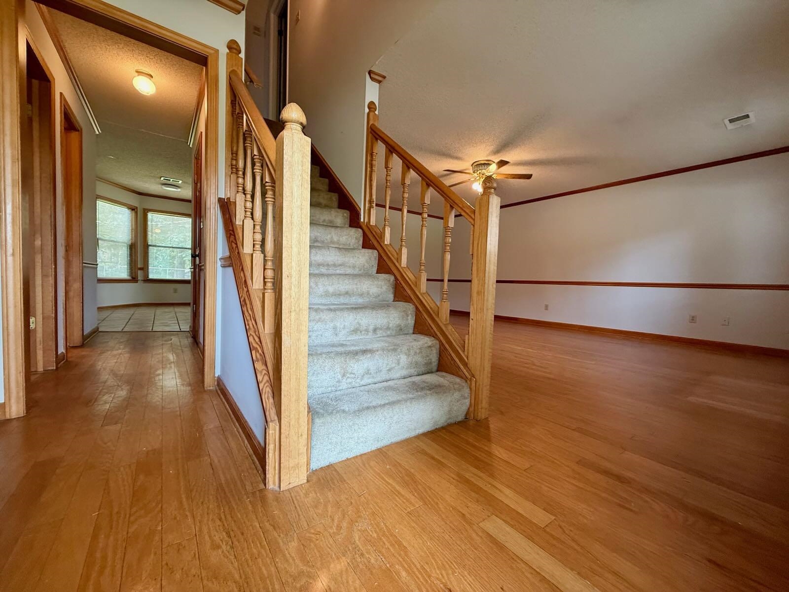 2151 Bartlett Road Memphis, TN 38134 - Photo 4 of 27 Staircase featuring wood-type flooring, ceiling fan, and baseboards