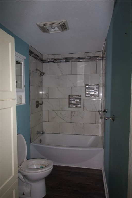 702 Jefferson Street Alice, TX 78332 - Photo 14 of 38 a bathroom with a toilet and shower