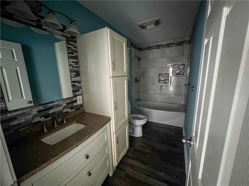 702 Jefferson Street Alice, TX 78332 - Photo 18 of 38 a bathroom with a sink toilet and shower