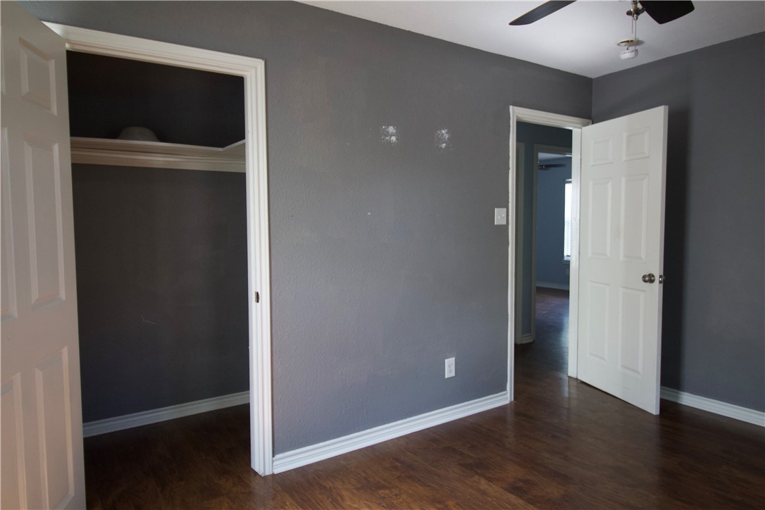 702 Jefferson Street Alice, TX 78332 - Photo 25 of 38 a view of an empty room with wooden floor