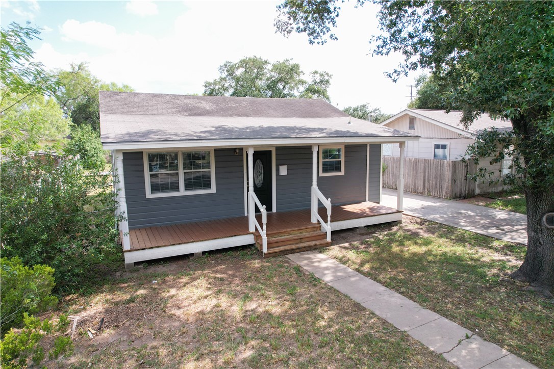 702 Jefferson Street Alice, TX 78332 - Photo 3 of 38 a view of a house with a large window and wooden fence