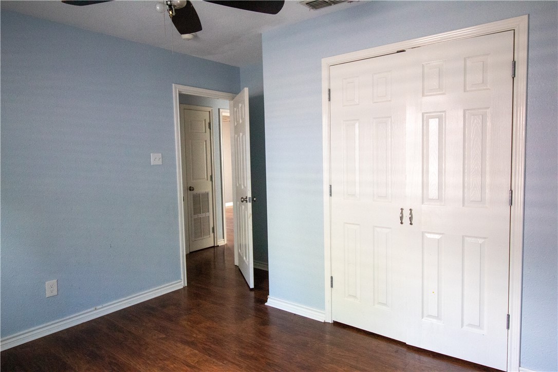 702 Jefferson Street Alice, TX 78332 - Photo 32 of 38 an empty room with wooden floor