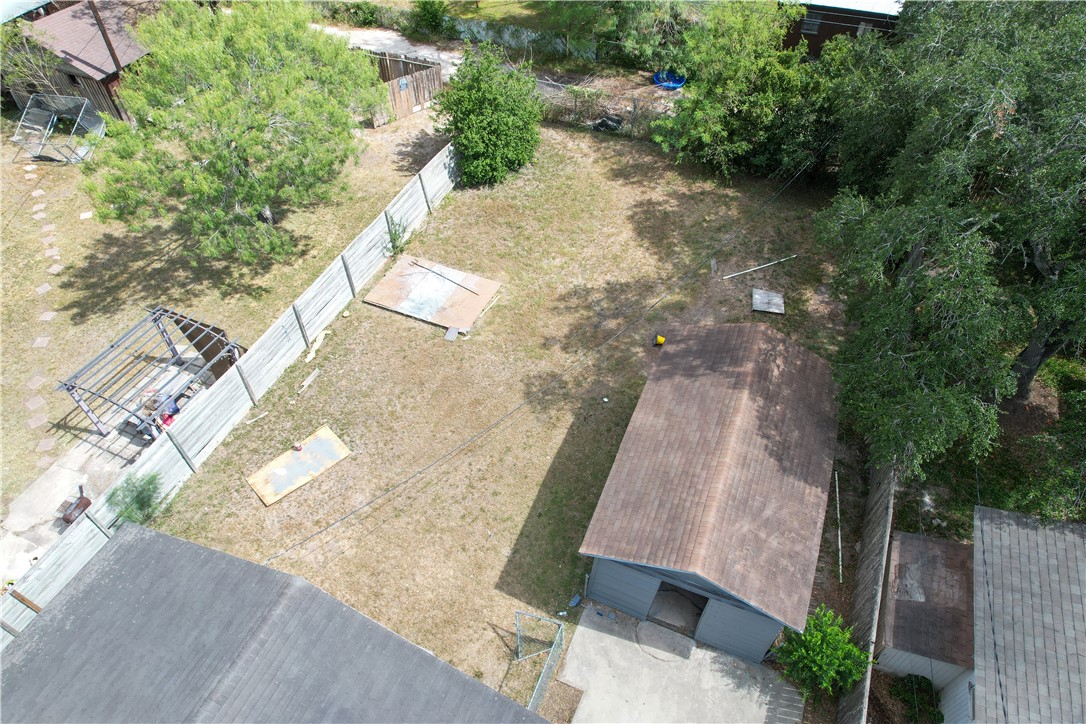 702 Jefferson Street Alice, TX 78332 - Photo 36 of 38 an aerial view of a house with a yard and trees all around