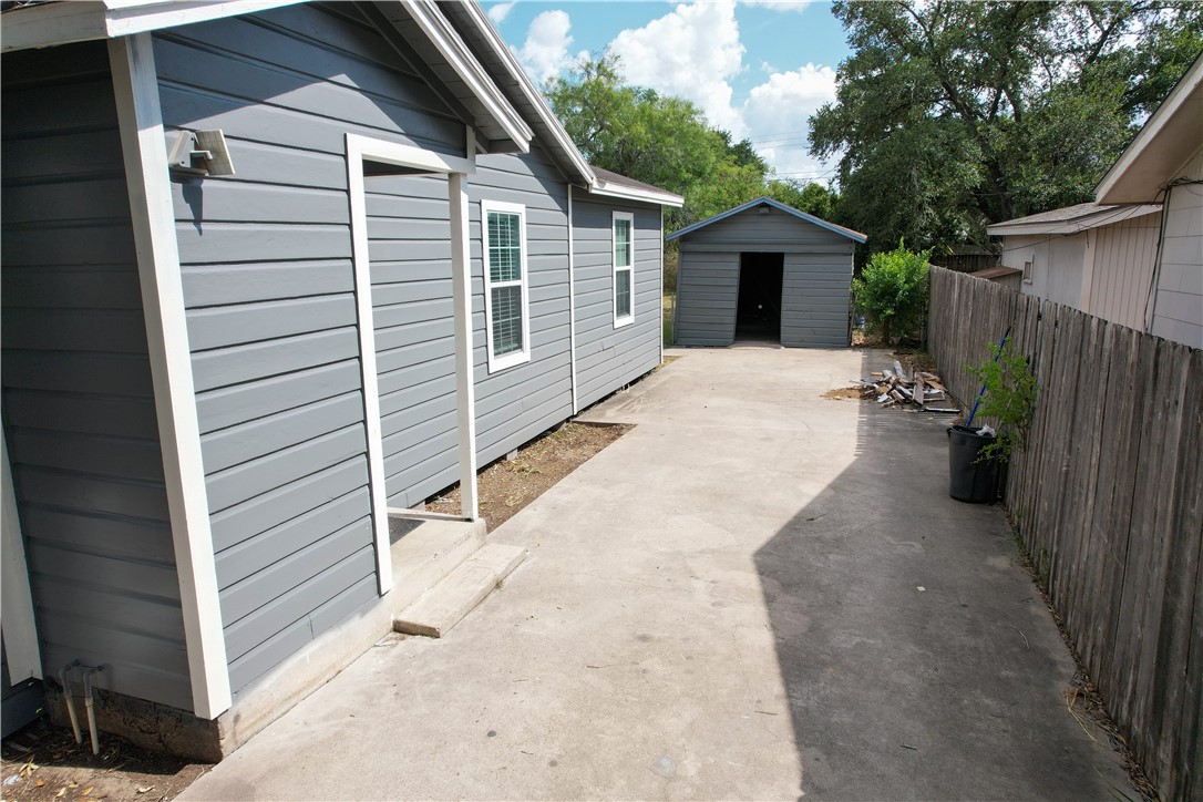702 Jefferson Street Alice, TX 78332 - Photo 5 of 38 a view of a house with a yard and wooden fence