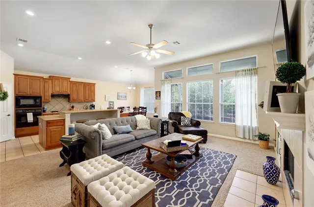 a living room with furniture fireplace and flat screen tv