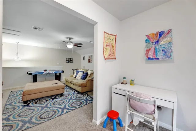 a bedroom with furniture and a chandelier