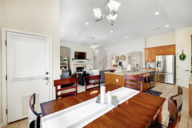 a living room with fireplace furniture and a flat screen tv