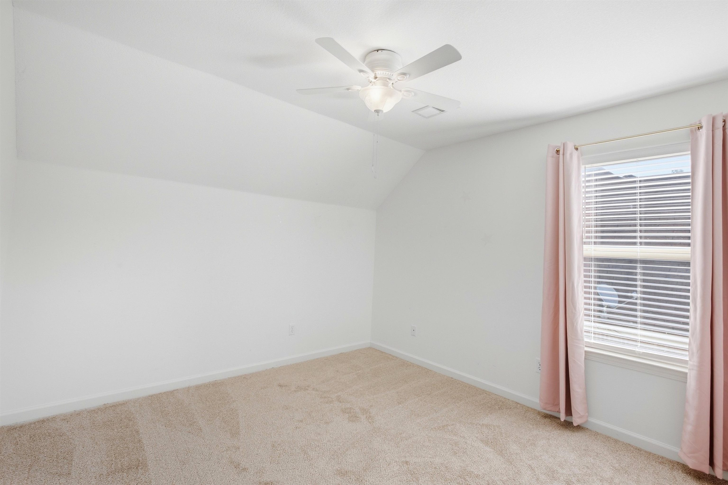 7920 Pips Ridge Lane Bartlett, TN 38133 - Photo 27 of 40 Carpeted flooring, sloped ceiling, and a ceiling fan with integrated lighting