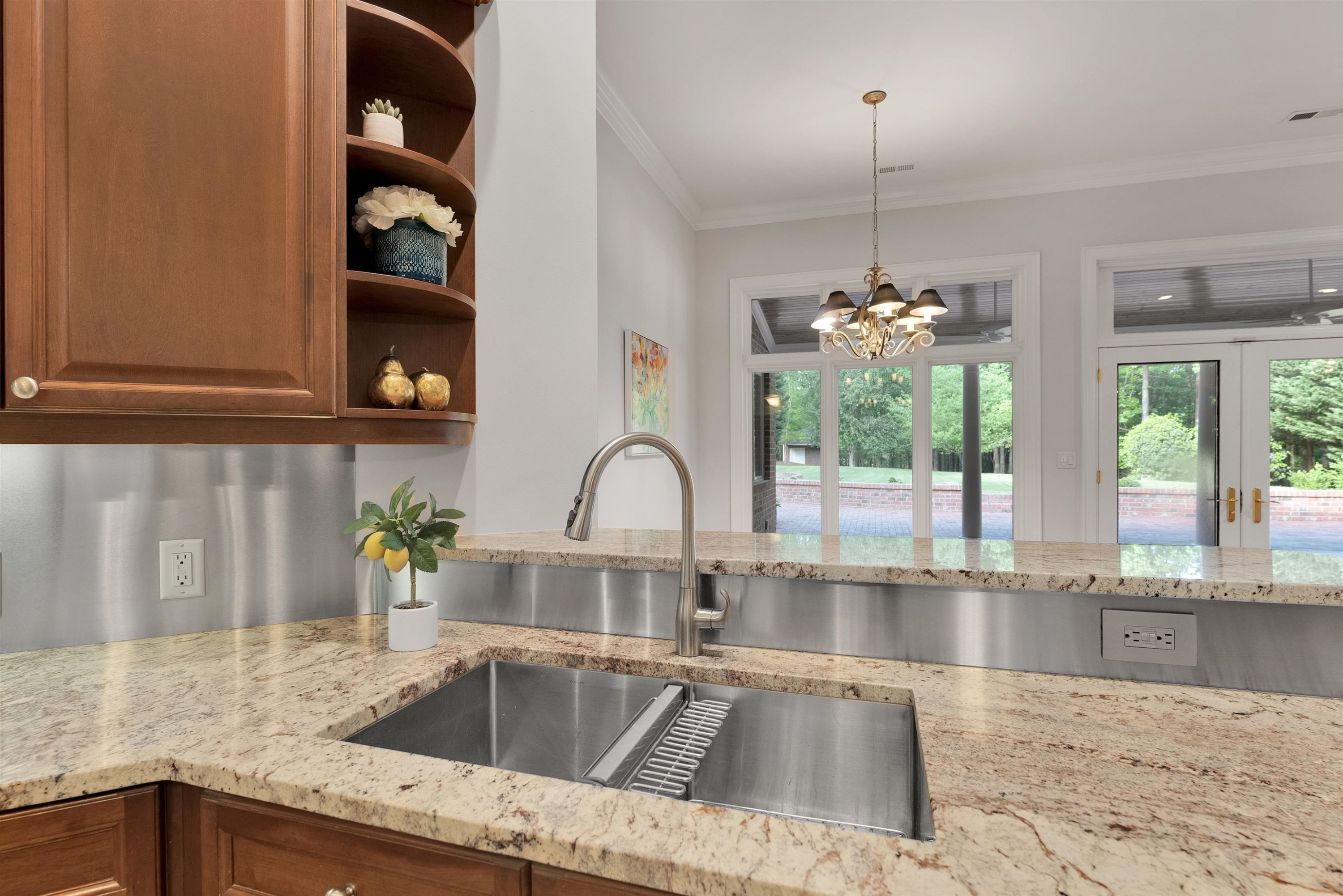 5204 Strathmore Drive Raleigh, NC 27613 - Photo 14 of 32 a kitchen with a sink and a window