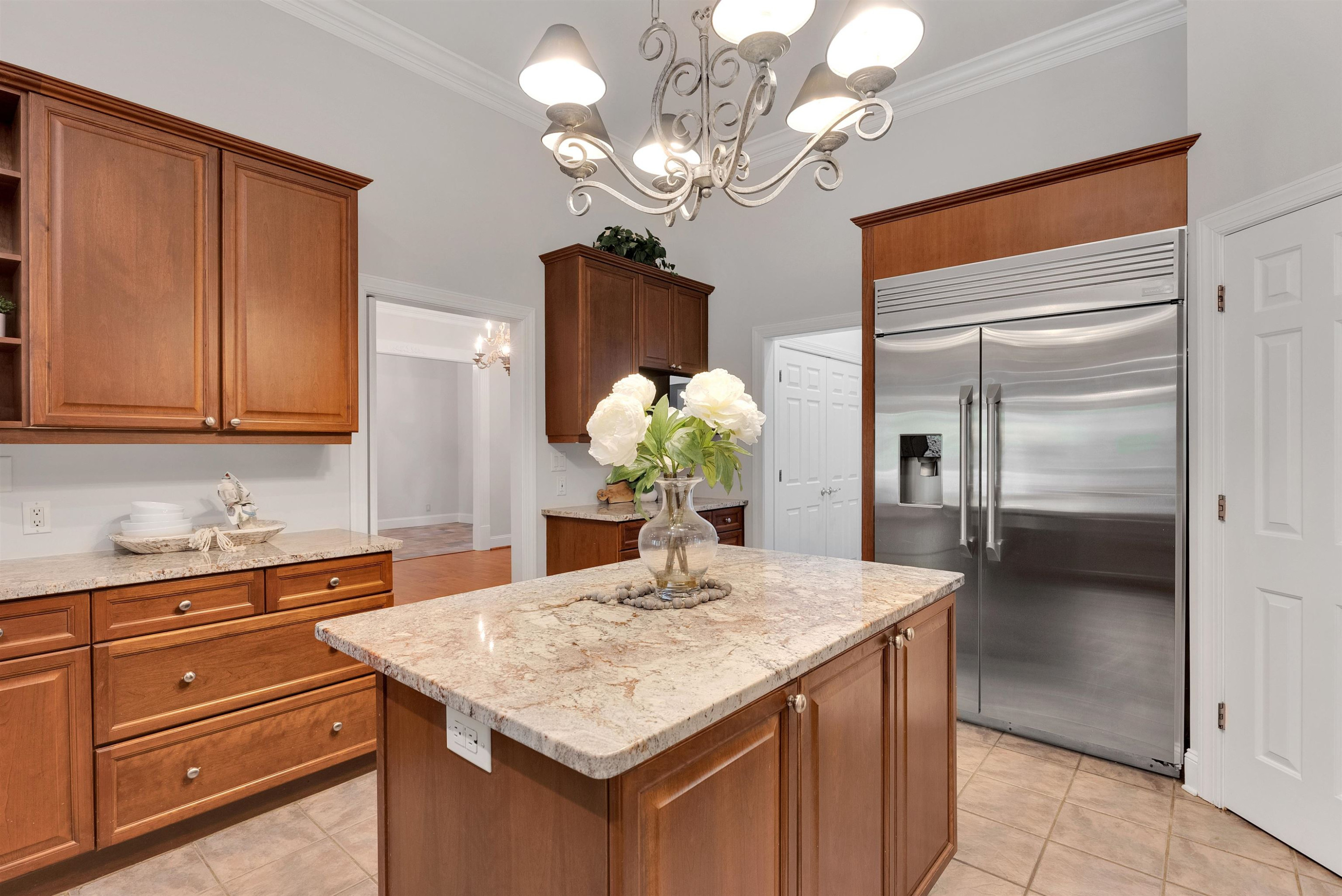 5204 Strathmore Drive Raleigh, NC 27613 - Photo 16 of 32 a kitchen with a counter space and a refrigerator