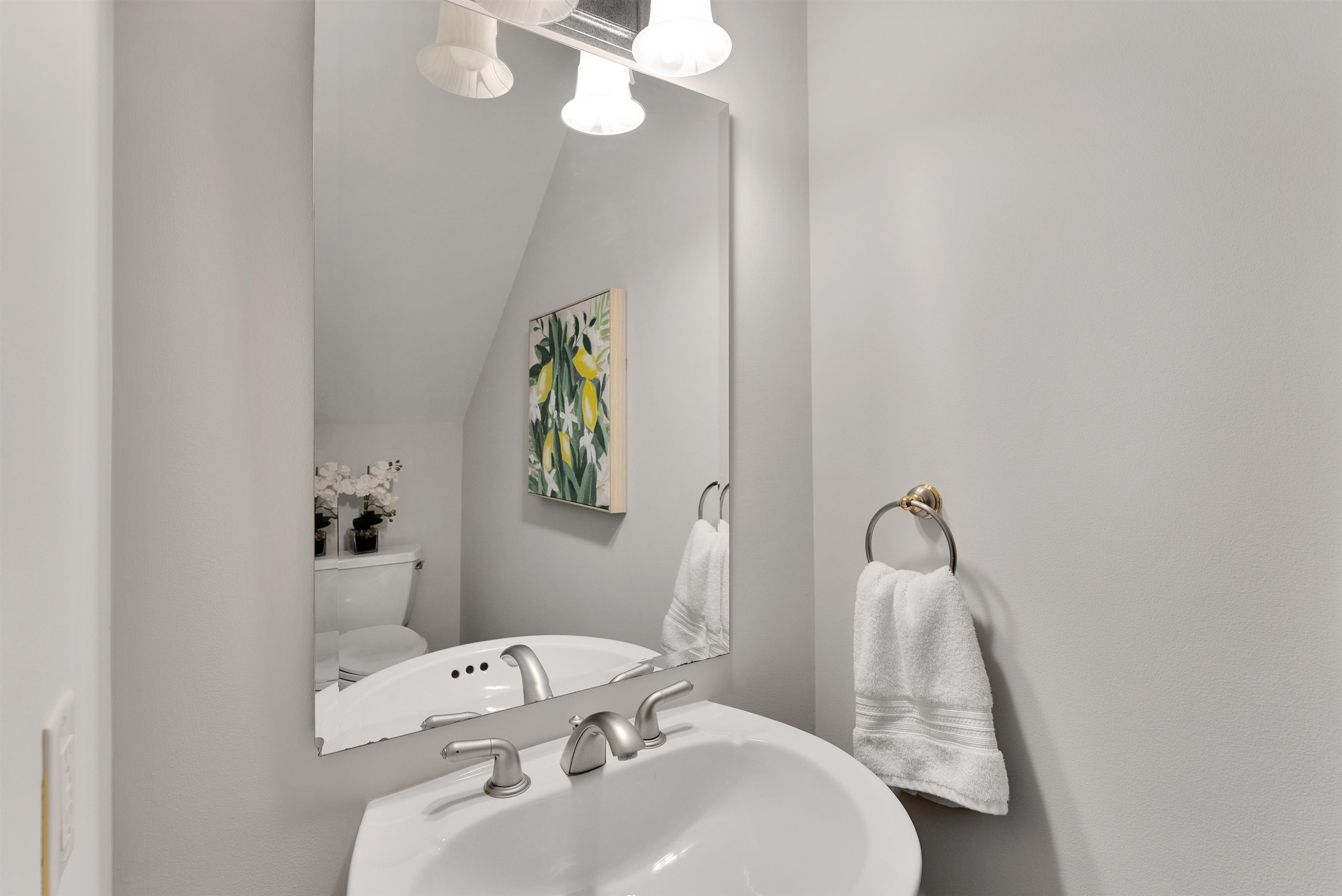 5204 Strathmore Drive Raleigh, NC 27613 - Photo 18 of 32 a bathroom with a sink and toilet