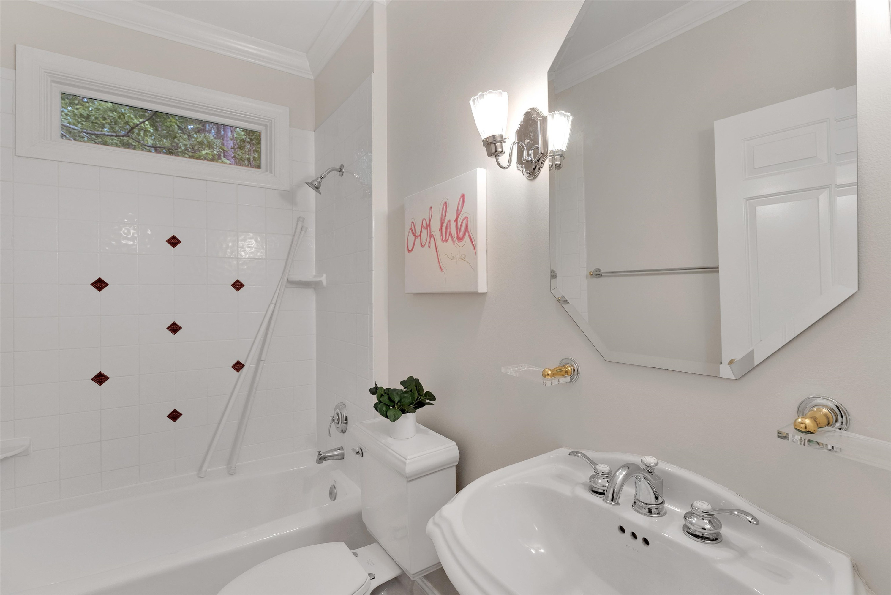 5204 Strathmore Drive Raleigh, NC 27613 - Photo 23 of 32 a bathroom with a sink a toilet and shower