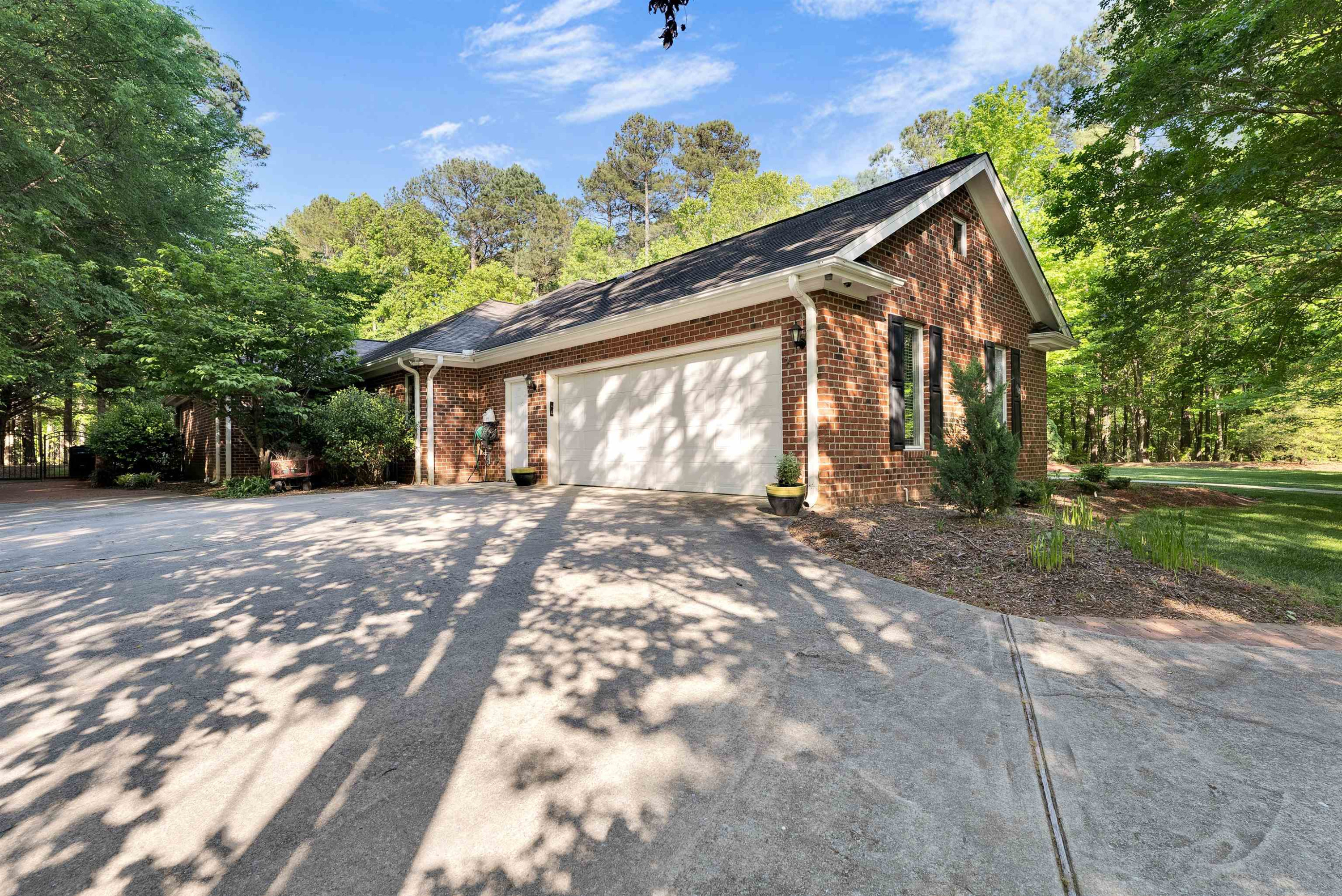 5204 Strathmore Drive Raleigh, NC 27613 - Photo 3 of 32 a view of a house with a yard