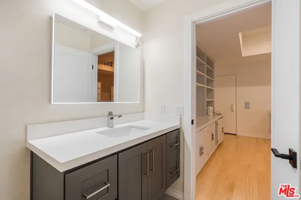 a bathroom with a sink and a mirror
