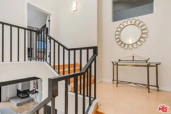 a view of a hallway with seating area and furniture