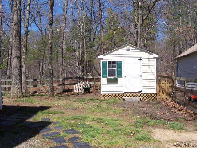 1430 Oldbury Road Midlothian, VA 23113 - Photo 5 of 10 a front view of a house with a yard