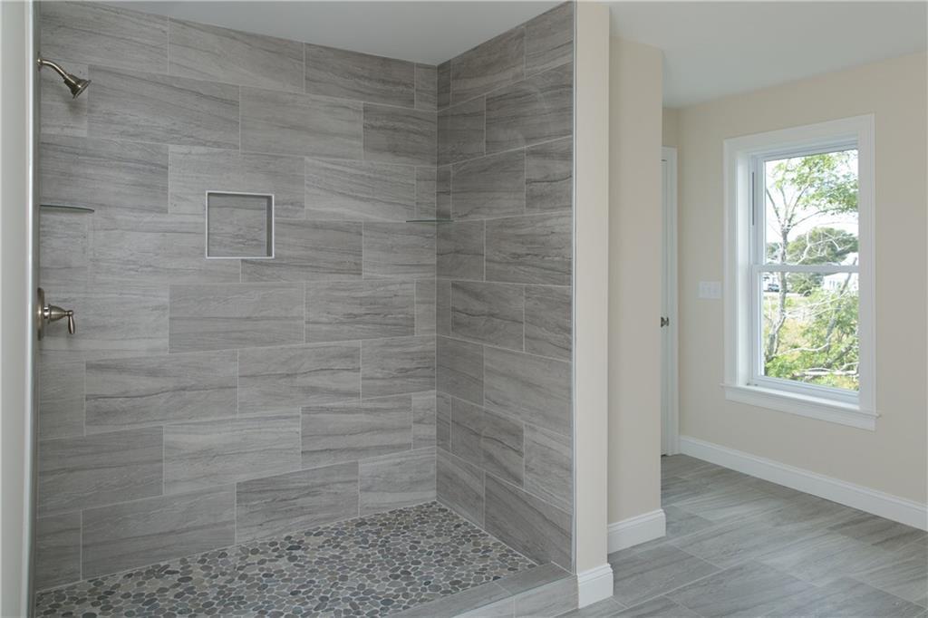 17 Riverside Avenue, Unit 102 Saco, ME 04072 - Photo 26 of 35 Custom shelving built in shower...
