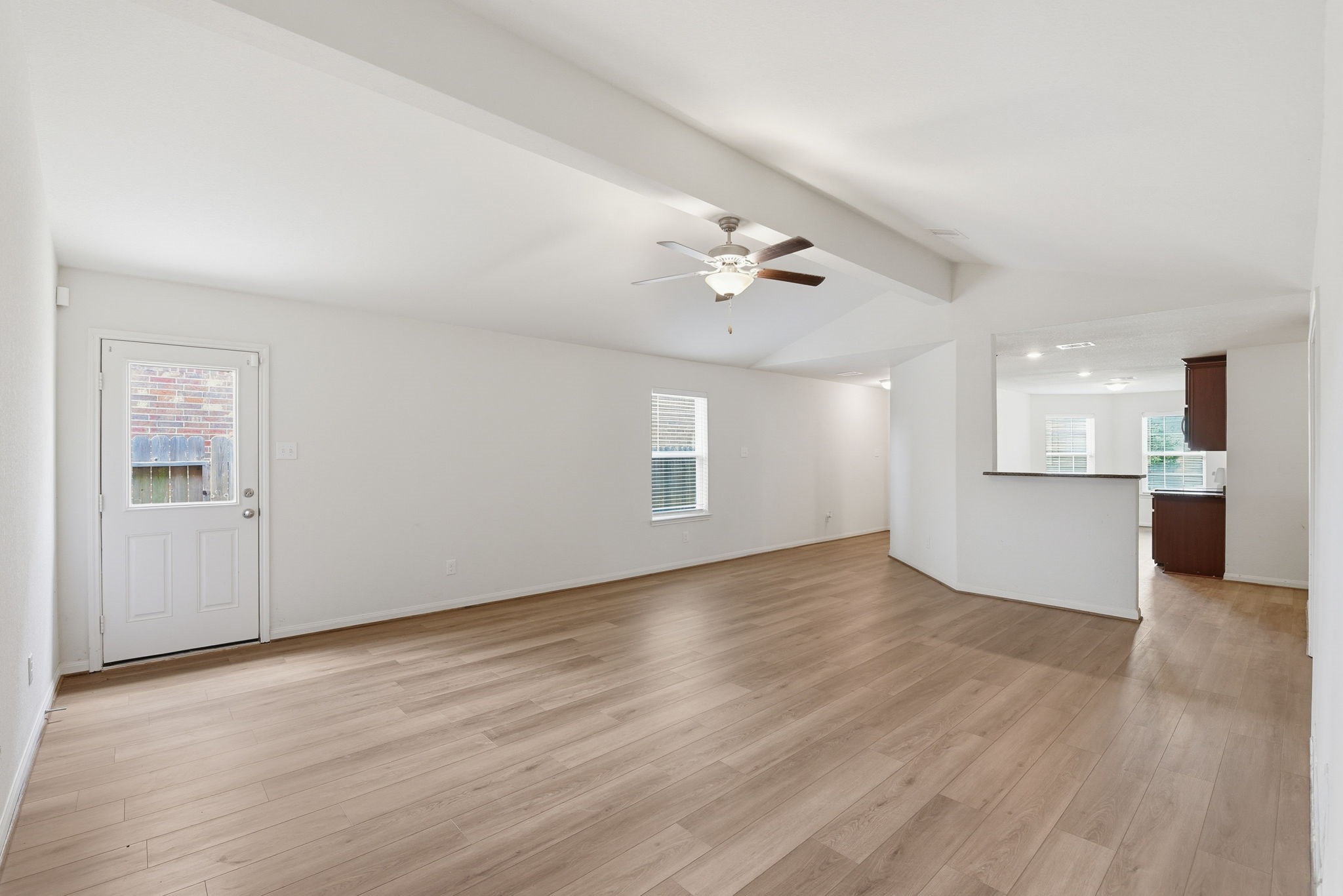 10802 Spring Brook Pass Drive Humble, TX 77396 - Photo 5 of 22 View of the living room into the kitchen.