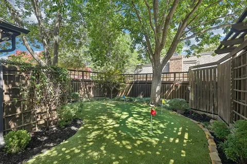 a backyard of a house with lots of green space
