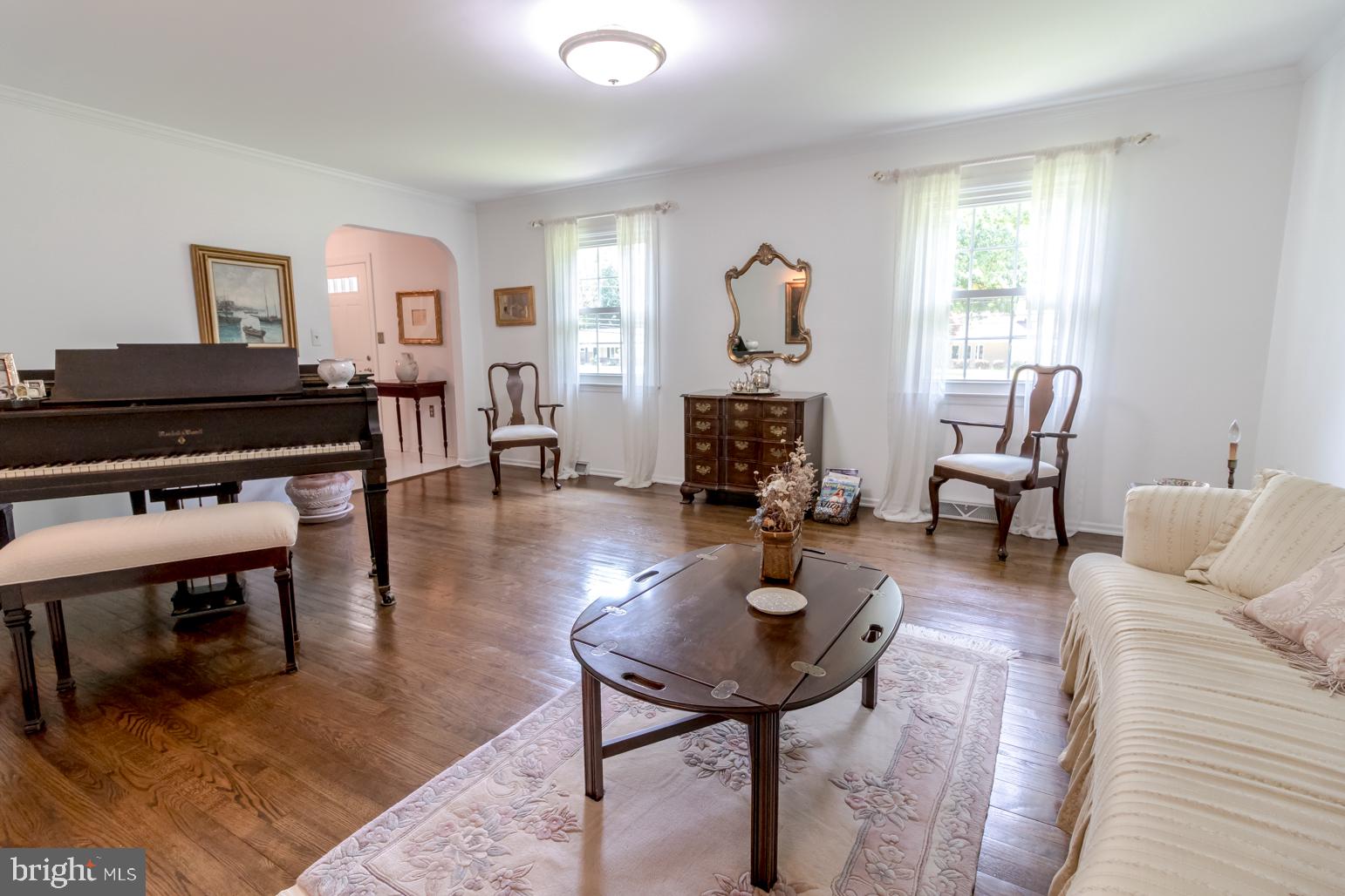 59 Tindall Road Trenton, NJ 08691 - Photo 11 of 76 a living room with furniture a table and a window