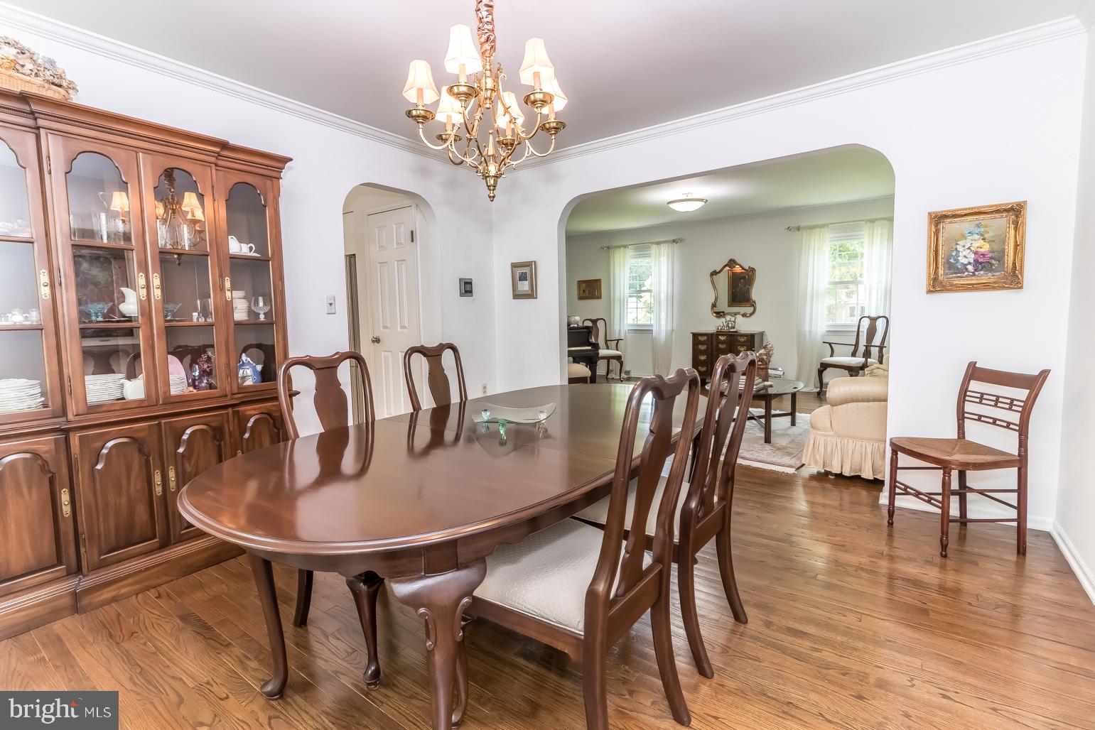 59 Tindall Road Trenton, NJ 08691 - Photo 13 of 76 a view of a dining room with furniture wooden floor and chandelier