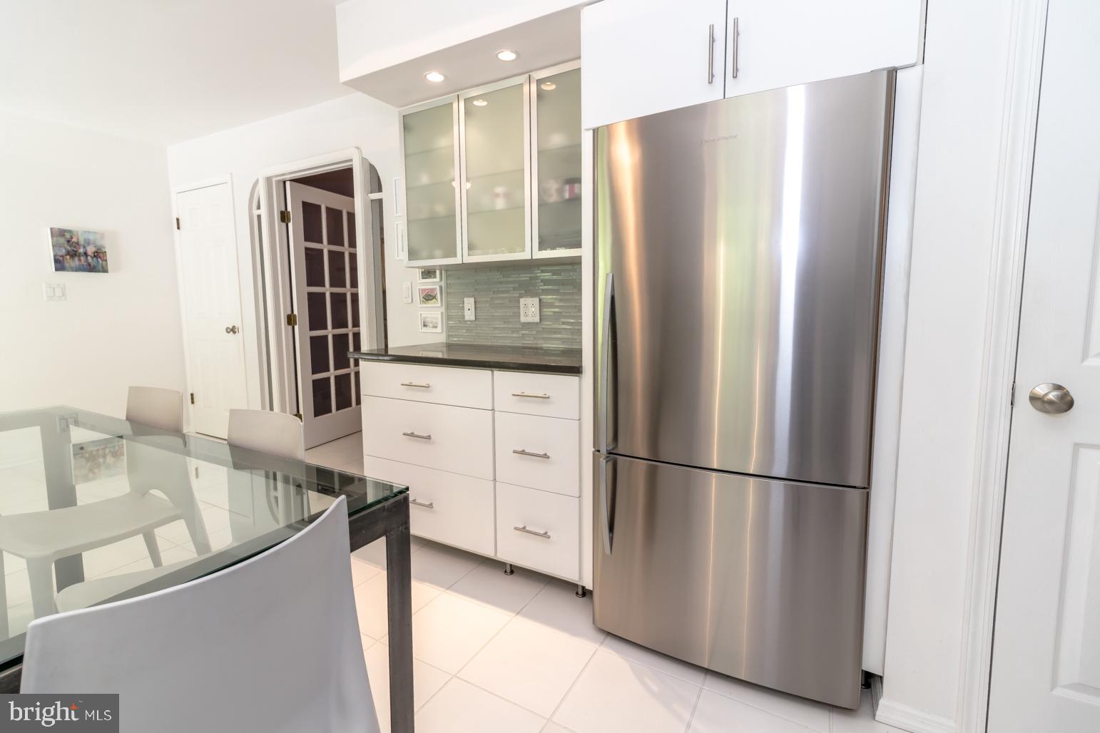 59 Tindall Road Trenton, NJ 08691 - Photo 23 of 76 a kitchen with stainless steel appliances granite countertop a refrigerator and a sink