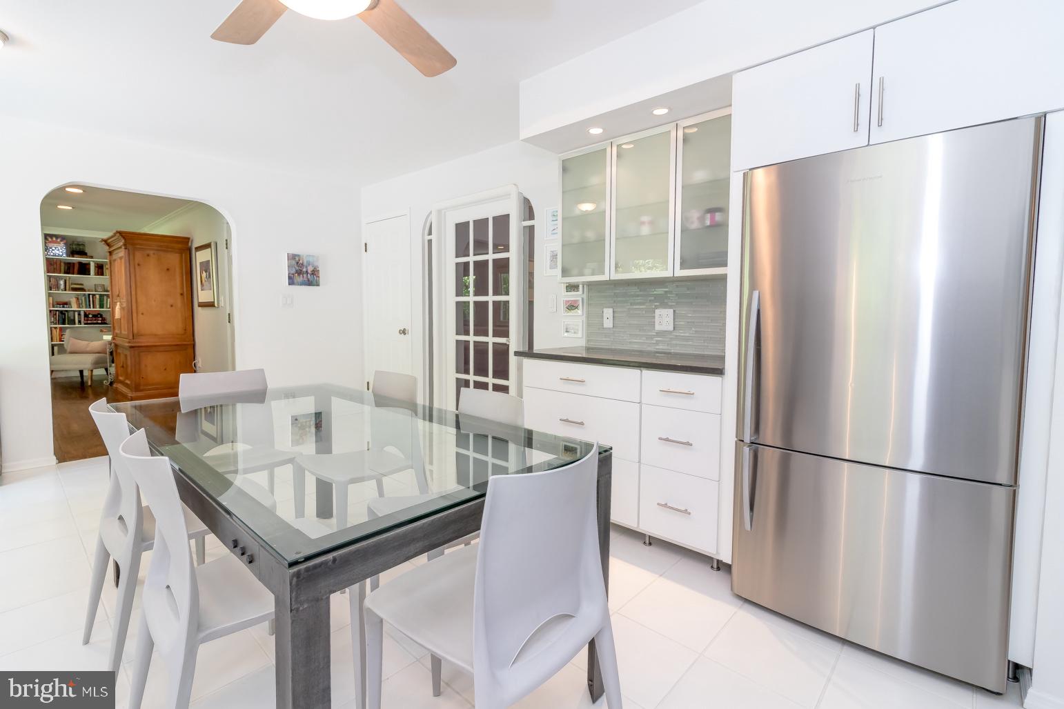 59 Tindall Road Trenton, NJ 08691 - Photo 24 of 76 a kitchen with stainless steel appliances granite countertop a table chairs and a refrigerator