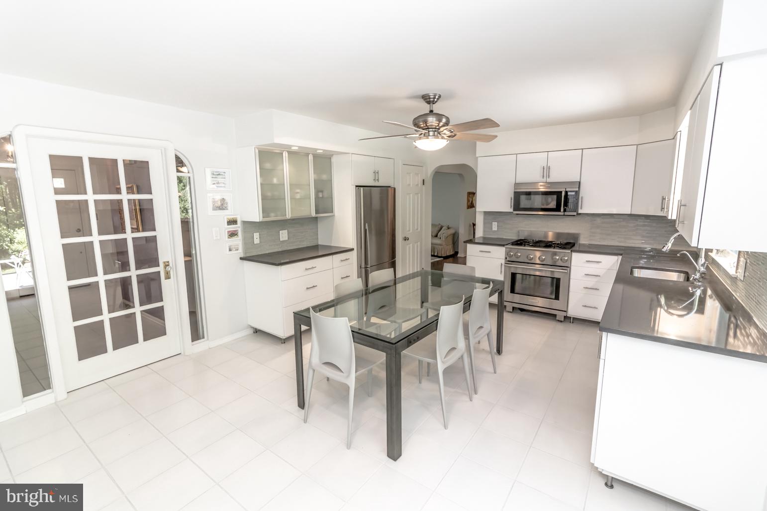 59 Tindall Road Trenton, NJ 08691 - Photo 27 of 76 a living room with stainless steel appliances kitchen island granite countertop furniture and a kitchen view