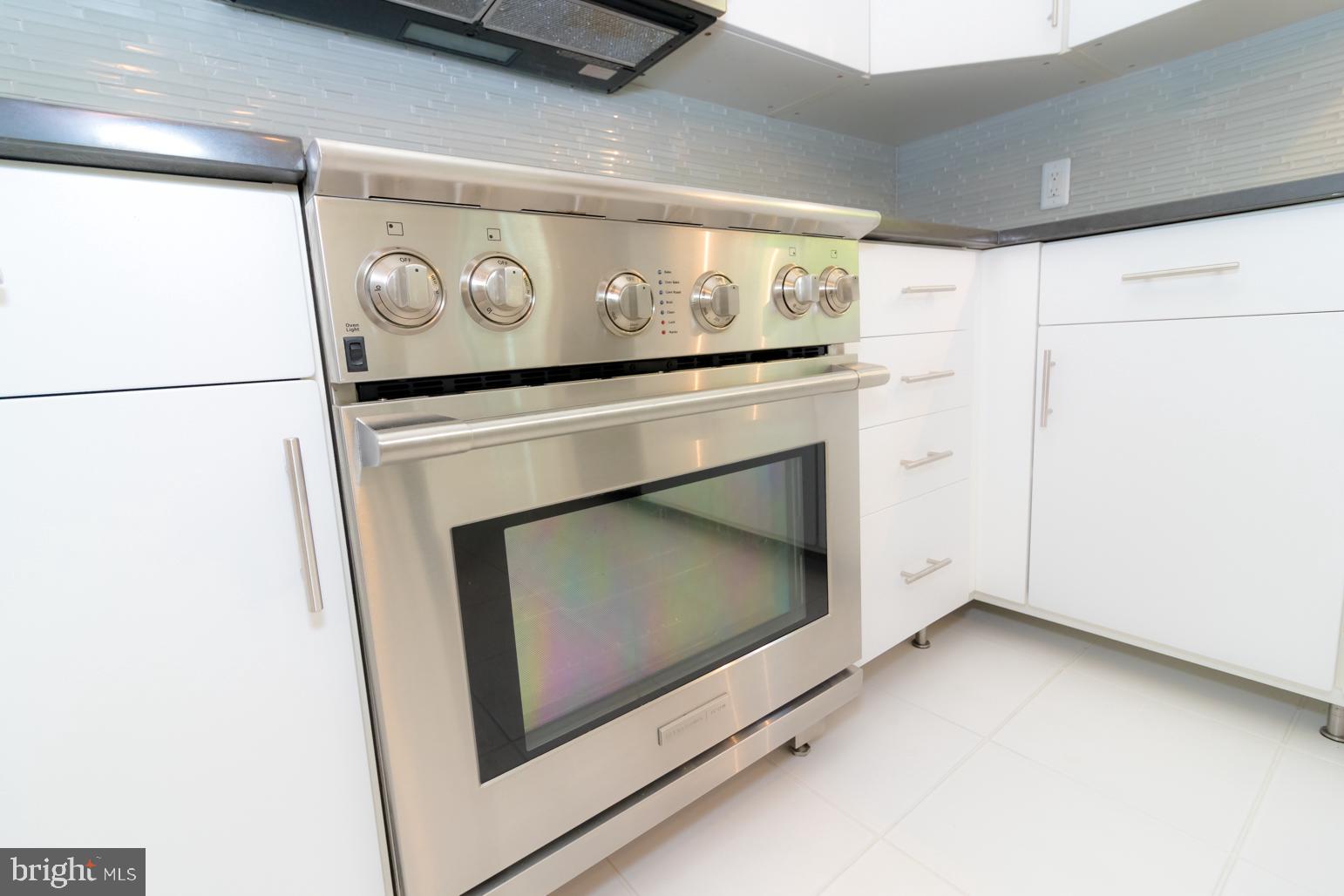 59 Tindall Road Trenton, NJ 08691 - Photo 30 of 76 a stove top oven sitting inside of a kitchen