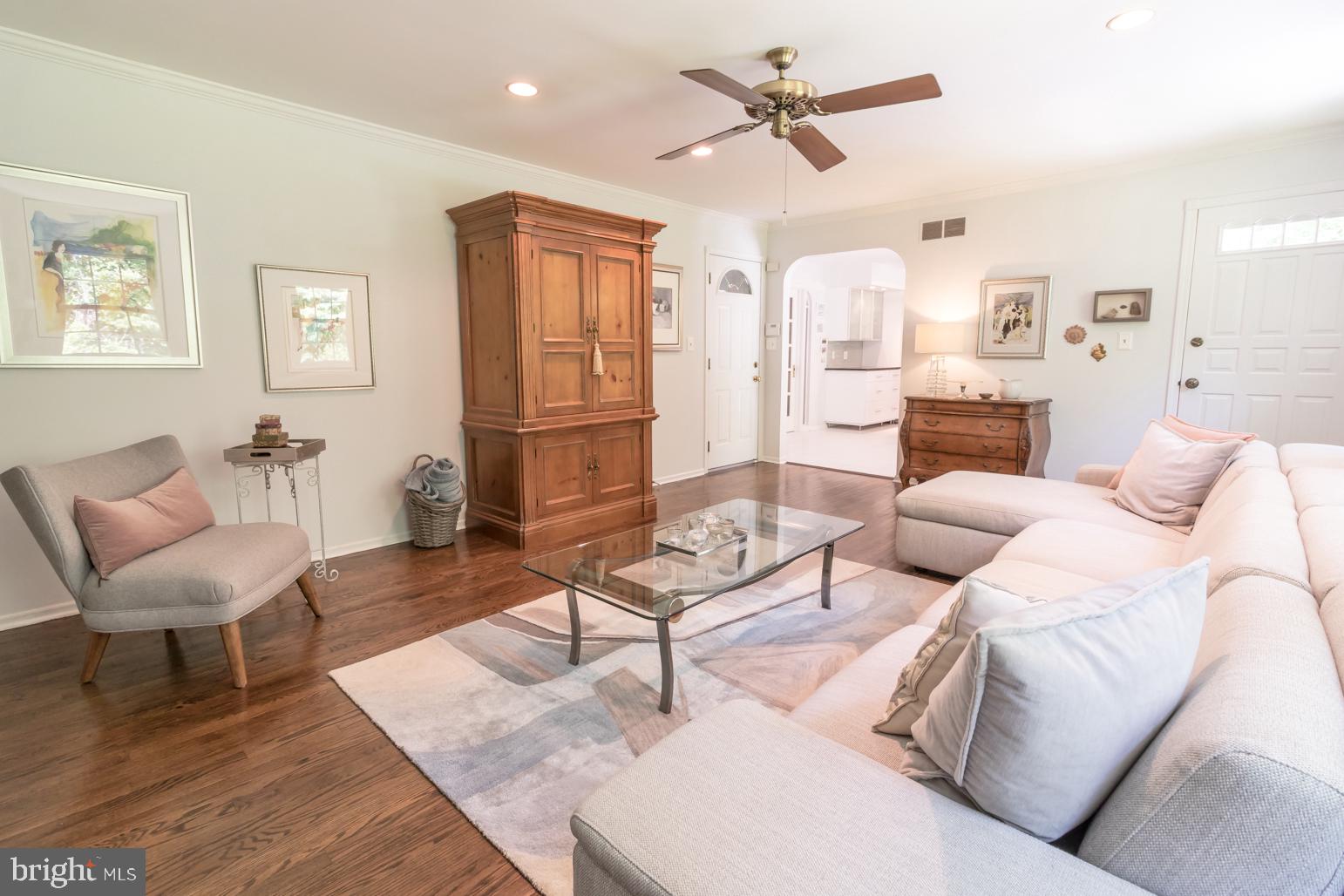 59 Tindall Road Trenton, NJ 08691 - Photo 35 of 76 a living room with furniture a rug and a chandelier