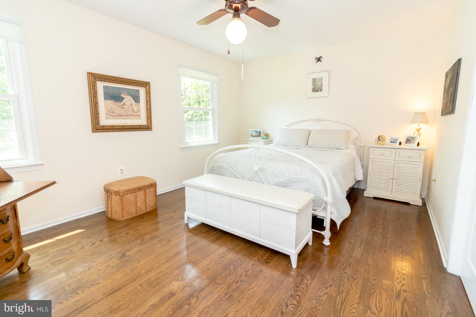 59 Tindall Road Trenton, NJ 08691 - Photo 49 of 76 a spacious bedroom with a bed and a chandelier