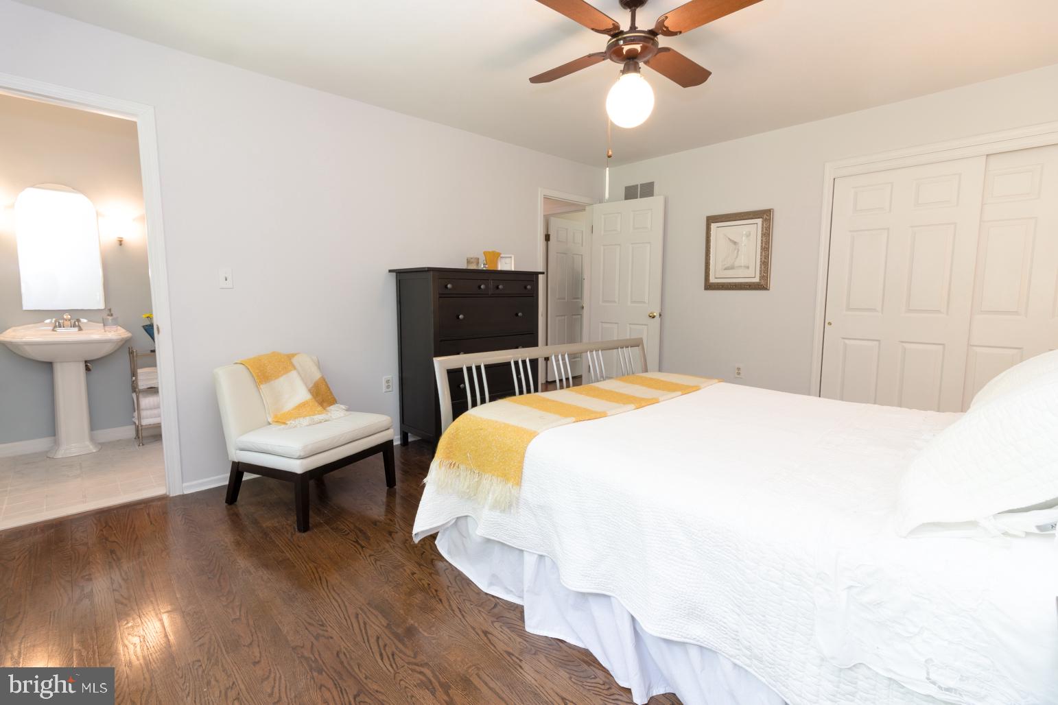 59 Tindall Road Trenton, NJ 08691 - Photo 53 of 76 a spacious bedroom with a bed and a chandelier