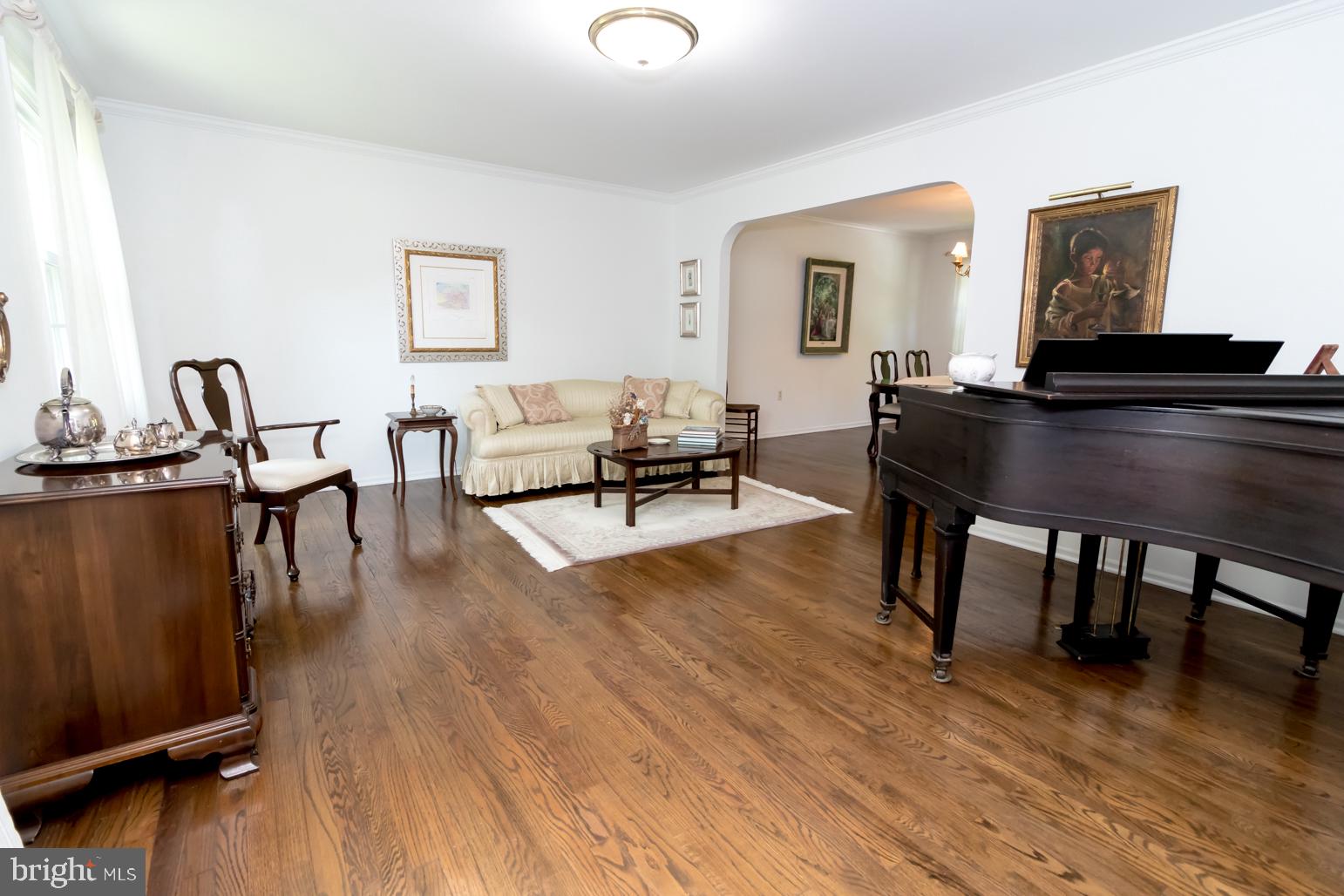59 Tindall Road Trenton, NJ 08691 - Photo 9 of 76 a living room with furniture wooden floor and a table