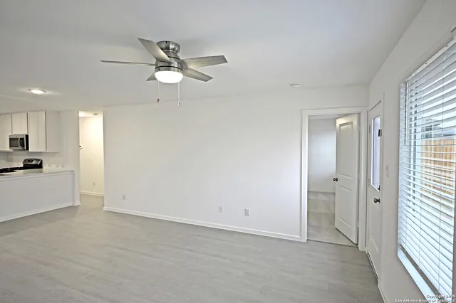 a view of an empty room with a window