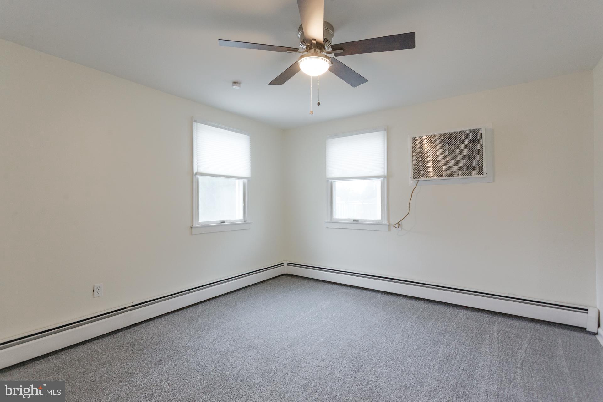 1007 Ripley Street Philadelphia, PA 19111 - Photo 15 of 27 an empty room with a window and a fan
