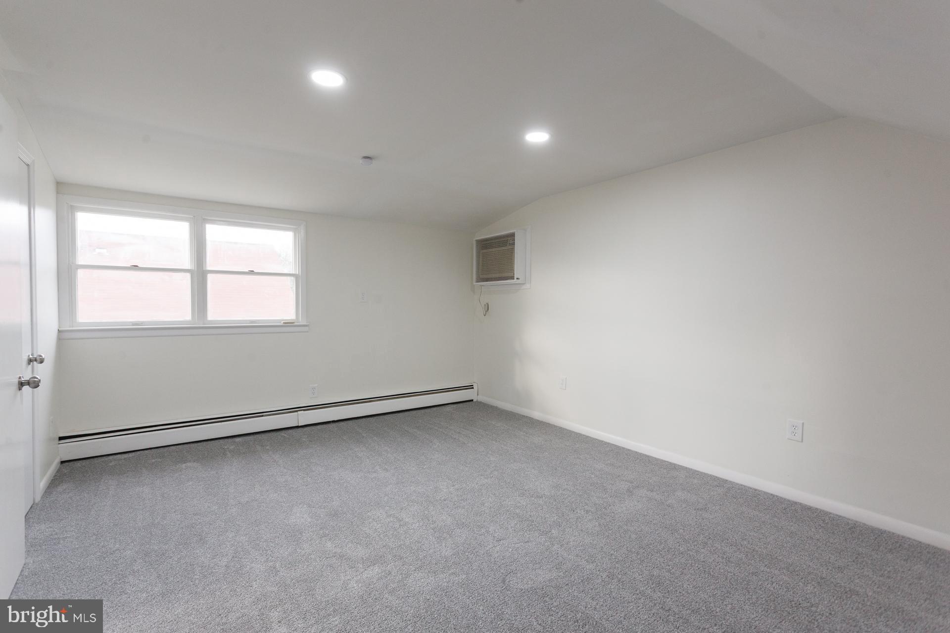 1007 Ripley Street Philadelphia, PA 19111 - Photo 25 of 27 an empty room with a window