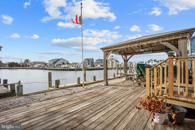 a view of a balcony with wooden floor